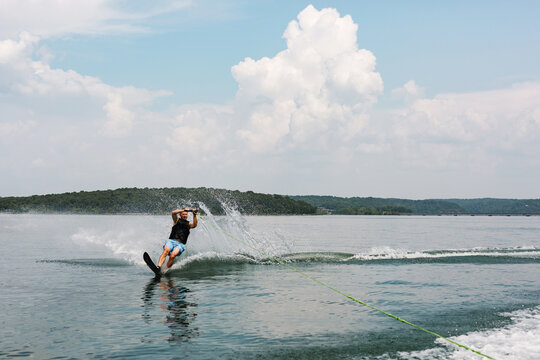 man water skiing on a lake
