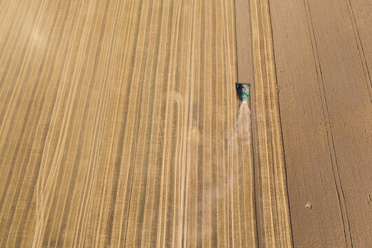 Aerial view of combine harvester in field