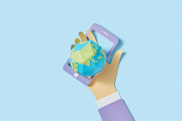 Papercraft phone and craft planet in the hand.