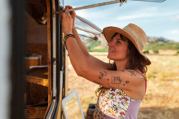 Entrepreneur women travelling in upcycling clothes caravan
