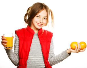 Little girl with oranges and juice