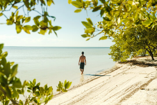 man walking on the beach