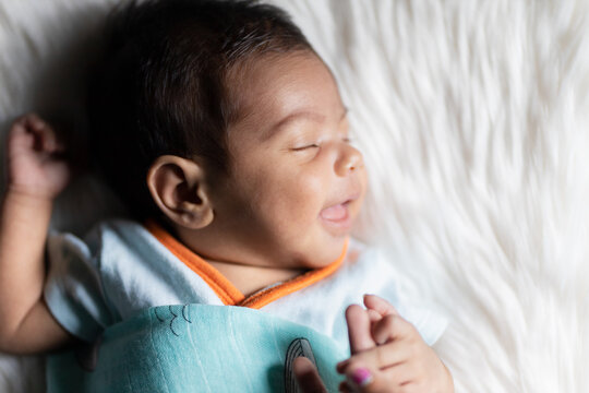 Cute Newborn Baby Smiling