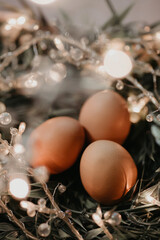 Easter eggs with lights in a tub close up.