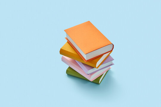 Stack of colored handcraft paper study books.