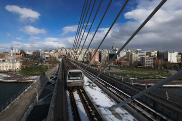 Fototapeta premium (Istanbul - Turkey 16.February.2021) It is a stretched inclined suspension bridge located on the estuary in Istanbul that enables the passage of the M2 metro line.