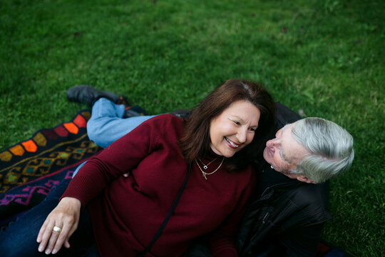 Affectionate older couple spending time together in a park.