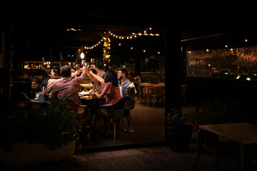 Friends Enjoying Dinner at Restaurant