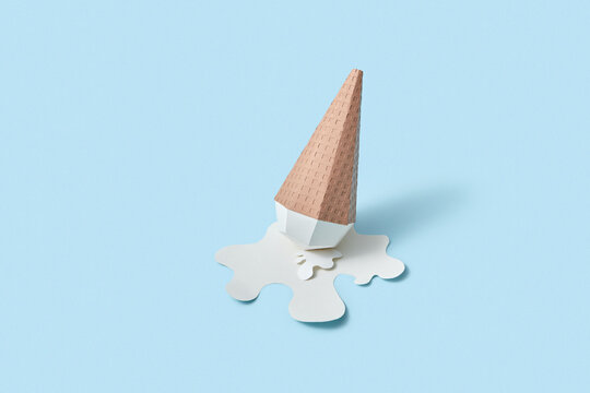 Papercraft ice cream cone in a paper puddle.
