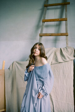 Portrait of a beautiful woman dressed in an old fashion dress