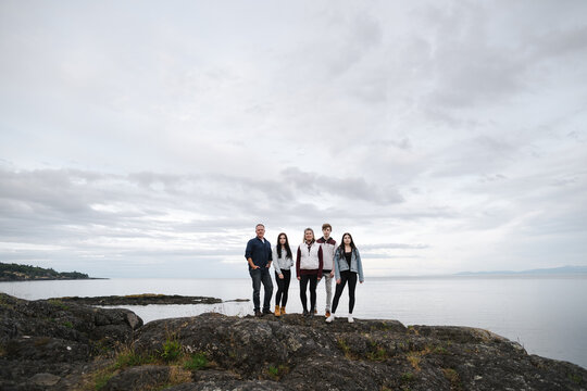 Content family portrait near the ocean