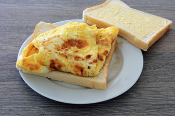 An Omelette Sandwich With A Dusting Of White pepper.