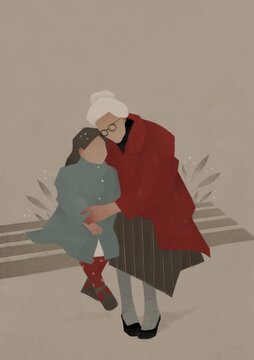 grandmother hugs her granddaughter while sitting on the bench. Aging up concept