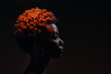 Side view of african woman posing in the studio