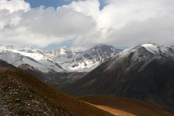 Mountain landscape view in Kyrgyzstan. Rocks, snow and stones in mountain valley view. Mountain panorama. Kyrgyz Alatoo mountains, Tian-Shan, Ala-archa, Kyrgyzstan.