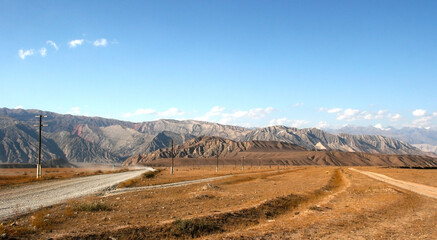 Fototapeta na wymiar Beautiful mountains in Kyrgyzstan near Kazarman. Beautiful landscape with mountains at Kyrgyzstan on sunny day
