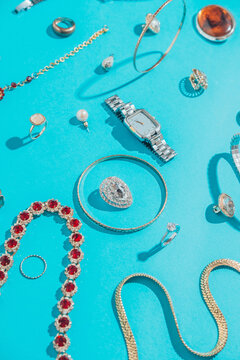 Jewellery,Diamonds, Ruby, Gold, Silver Etc/ On Turquoise Background
