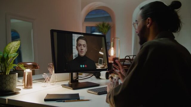 Employee communicates with boss using videocall on computer