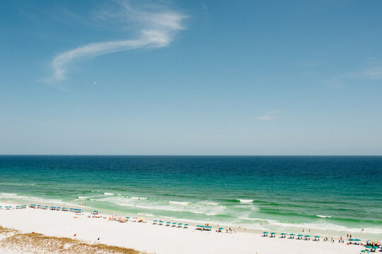 Vacationers on the ocean shoreline.