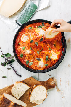 Food: poached eggs in tomato sauce