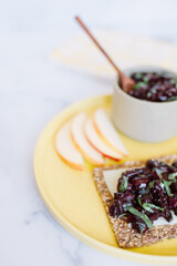 summer cherry relish on a seed cracker