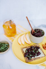 summer cherry relish snack on a seed cracker