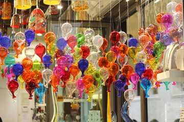 Venetian glass in a shop window, consisting of colorful balls 