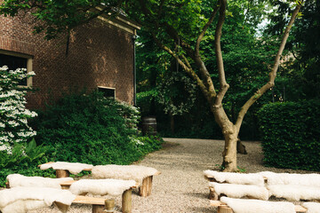 wooden benches with sheepskin for small and intimate wedding ceremony outdoors