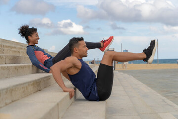 Couple doing Abdominals Workout Outdoor
