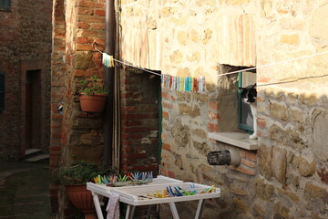 Drying colorful laundry in an ancient Tuscan town