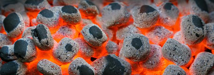 Glowing ember fire coals during barbecue background. 