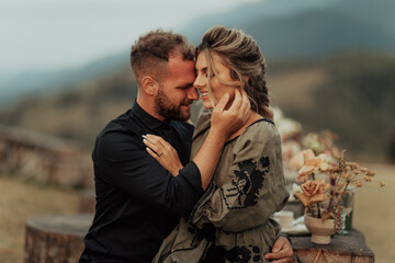 Happy couple hugging and smiling spending time at their intimate wedding