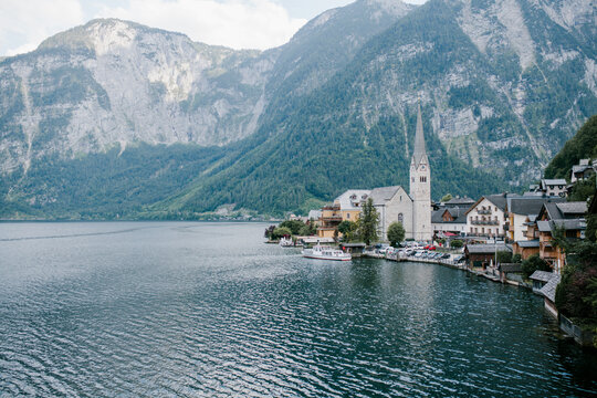 Town on the lake in mountains with chappel