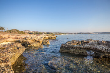 Fototapeta na wymiar Beautiful Cyprus landscape with a rocky coast. Mediterranean sea in Cyprus. Rocky beach against the blue sky