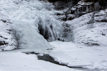 Frozen Sweetcreek Falls in winter.