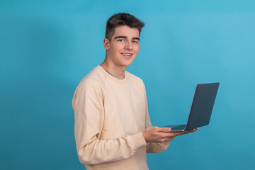 teenager with laptop isolated on background