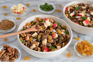 Bowl of vegetarian mixed salad, with lentils, apples, nuts and spices