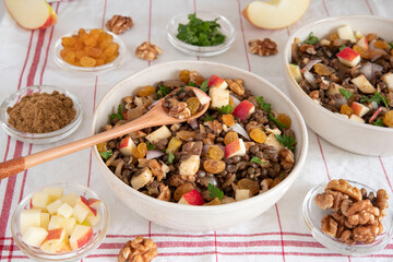 Bowl of vegetarian mixed salad, with lentils, apples, nuts and spices