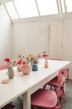 Table Set For Dinner With A Lot Of Pink Elements