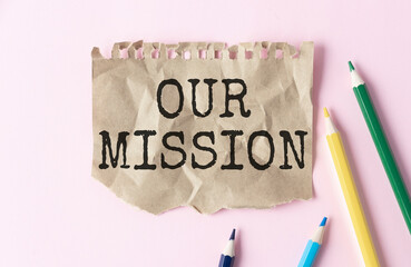 Our Mission text on paper. Word Our Mission on torn paper. Concept Image.