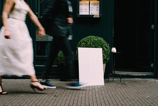wedding couple walking fast in the city