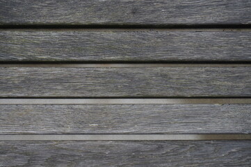 wooden planks of a bench