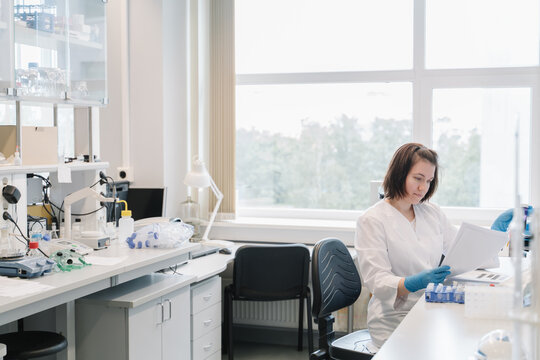 Female Researcher Analyzing Data In A Lab