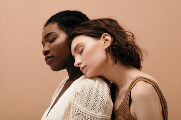 Multiracial young women with closed eyes