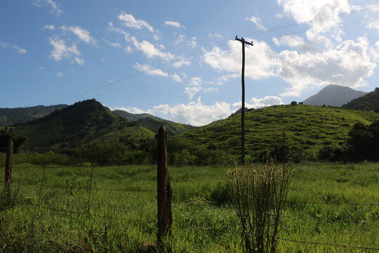 view of mountains and countryside in Bicuda Grande, Maca&eacute;, mountain region of Rio de Janeiro, Brazil. Sunny day with few clouds