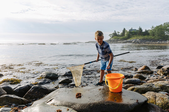 Young Child on Rocky Coast of Maine