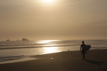 Surfer at sunset after a great ride. Lima Peru
