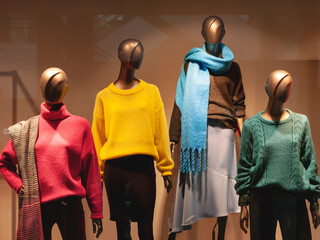 Shop mannequins wearing colorful clothes