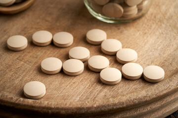 Obraz na płótnie Canvas Brewer's yeast tablets, nutritional supplement rich in vitamin B