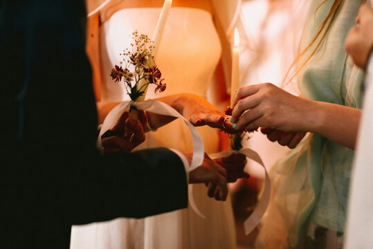 close up of wedding ring on little finger of the groom for orthodox wedding